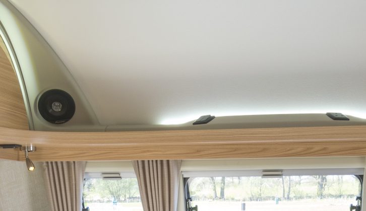 Speakers and lights share space above the Coachman Vision 580/5's front open shelf with a mains socket, say Practical Caravan's reviewers
