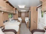 Here you can see the two fixed single beds in the 2015 Bailey Unicorn Cadiz, the washroom running across the caravan's rear