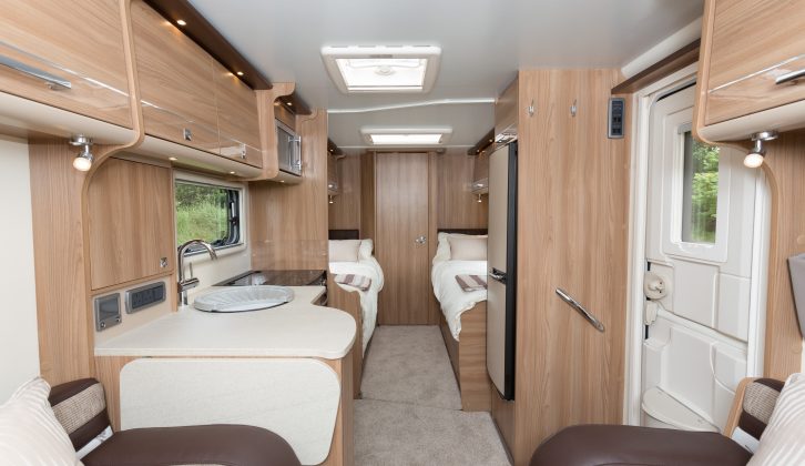 Here you can see the two fixed single beds in the 2015 Bailey Unicorn Cadiz, the washroom running across the caravan's rear