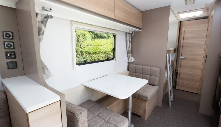 There's a neat side dinette in the Adria Altea 552DT Tamar, which can provide extra kitchen worktop space