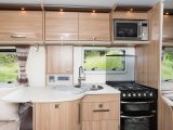 The fold-out worktop in the kitchen helps increase food preparation space in  the Bailey Unicorn Cadiz