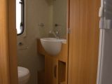 The toilet and handbasin are in a separate cubicle, across the Coachman VIP 545/4's gangway from the shower unit, note Practical Caravan's expert reviewers