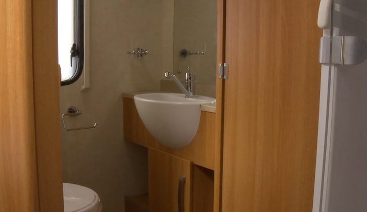 The toilet and handbasin are in a separate cubicle, across the Coachman VIP 545/4's gangway from the shower unit, note Practical Caravan's expert reviewers