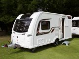 The Practical Caravan Coachman Pastiche 460/2 review reveals that this smart looking two-berth is a touch narrower than before, but to the benefit of cost and weight