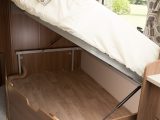There is an enormous storage space beneath the fixed bed of the Venus 540/4, but there is no external access to it, observe the reviewers from Practical Caravan