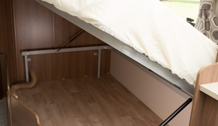 There is an enormous storage space beneath the fixed bed of the Venus 540/4, but there is no external access to it, observe the reviewers from Practical Caravan