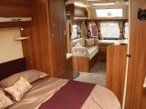 The transverse island bed in the Elddis Affinity 554 can be retracted during the day to ease access to the washroom