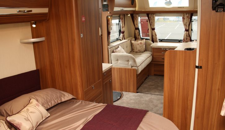 The transverse island bed in the Elddis Affinity 554 can be retracted during the day to ease access to the washroom