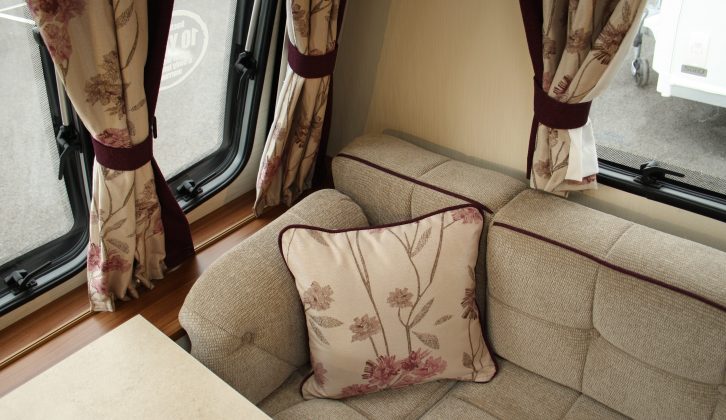 The curtains and cushions add a floral touch to the decor of the Elddis Affinity 554, which also has 'Chivago' upholstery fabric with purple piping