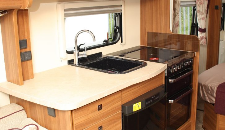 The Elddis Affinity 554's kitchen looks upmarket, with its attractive cabinet work, full battery of appliances and plethora of work and storage space, says Practical Caravan