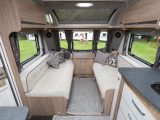 The matt-finish wallboard, upholstery and flooring of the Coachman VIP 575/4 look contemporary, while generous glazing and a large sunroof make the lounge light