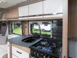 Even the draining board is a designer item, but the kitchen of the Coachman VIP 575/4 is not style over substance – there's plenty of kit, worktop and clever storage space