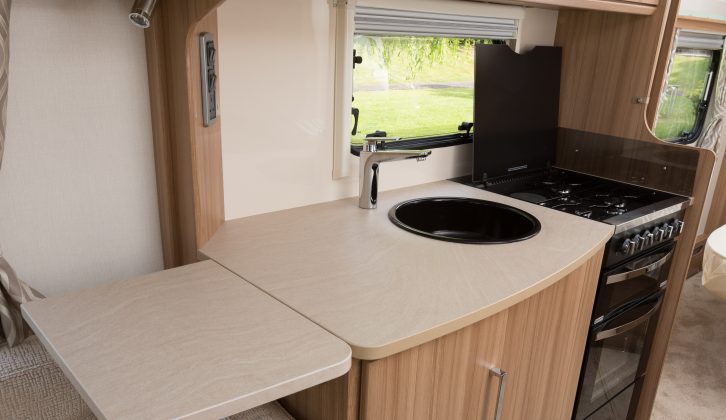 The kitchen of the Lunar Delta TI is flashy, with a snazzy cocktail cabinet, backlit cupboards fronted by translucent doors – in addition to all the essentials