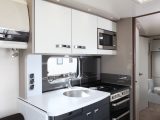 The four-berth Continental 630 has a well-equipped kitchen with a large fridge, plus a worktop extension flap – great for caravanning cooks