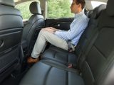 The second row of seats provides passengers with ample leg and headroom, air vents, wide entrances and fold-out tables