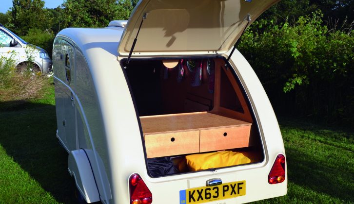 Lift the Standard Pod's tailgate to provide a view of the outside world, as well as for fixing breakfast