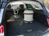 Catches on top of the Vauxhall Insignia's rear seat back must be released in order to fold it down and extend the boot, giving you more space for luggage on your caravan holidays