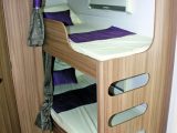 The ladder has been cleverly integrated into the structure of the fixed bunks – find out more about these well designed bunks in the Practical Caravan Lunar Quasar 586 review