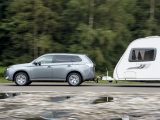 At motorway speeds, the Mitsubishi Outlander PHEV holds a straight course and needs little steering input – read more in the Practical Caravan review