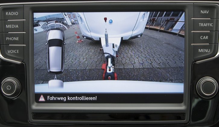 The car's reversing camera calculates the angle of the tow hitch to work out how much steering input is required