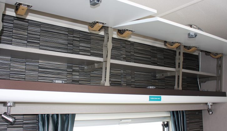 The roof lockers above the side dinette are shelved in the award-winning Sterling Eccles Sport 524 caravan