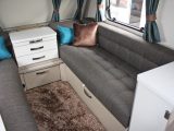 The sofas in the lounge of the Sterling Eccles Sport 524 caravan are long enough to use as single beds. The offside single is 1.90m x 0.69m and the other is 1.80m x 0.69m. Use the pull-out slats to turn the twin sofas into a double bed measuring 2.02m x 1.4m