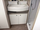 In the washroom there's an attractive vanity unit with generous basin, sitting between the wardrobe and shower in the Sterling Eccles Sport 524
