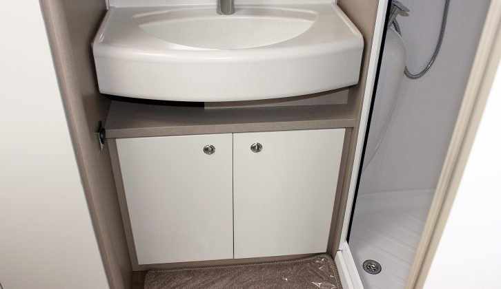 In the washroom there's an attractive vanity unit with generous basin, sitting between the wardrobe and shower in the Sterling Eccles Sport 524