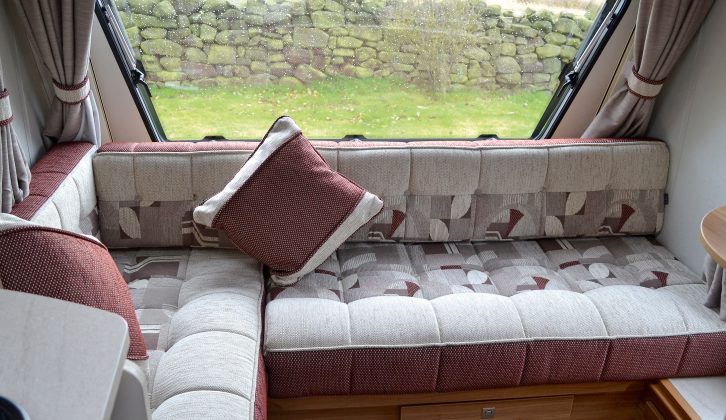 The L-shaped seating makes the most of the limited space in this compact caravan's lounge