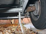 If you're using axle stands for this job, they should be directly under the axles and as near the chassis as possible
