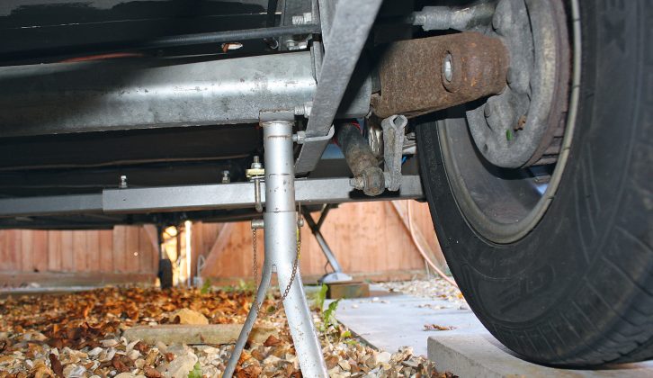 If you're using axle stands for this job, they should be directly under the axles and as near the chassis as possible