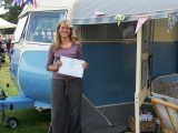 The vintage caravan's awning space is perfect for Nic to display her artwork at shows