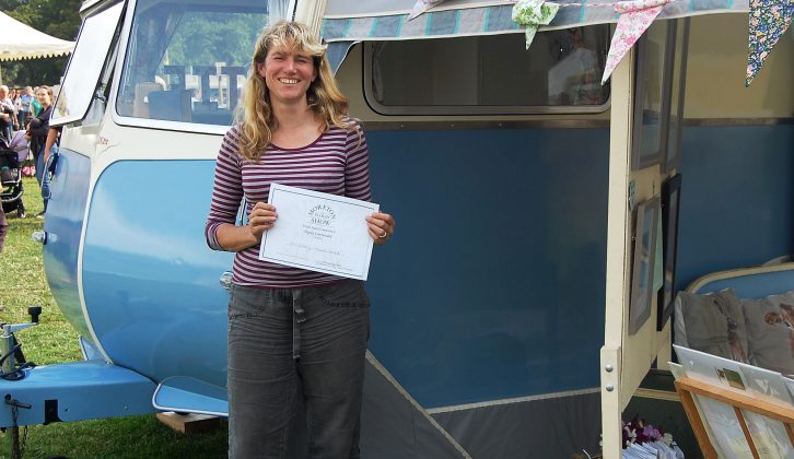 The vintage caravan's awning space is perfect for Nic to display her artwork at shows
