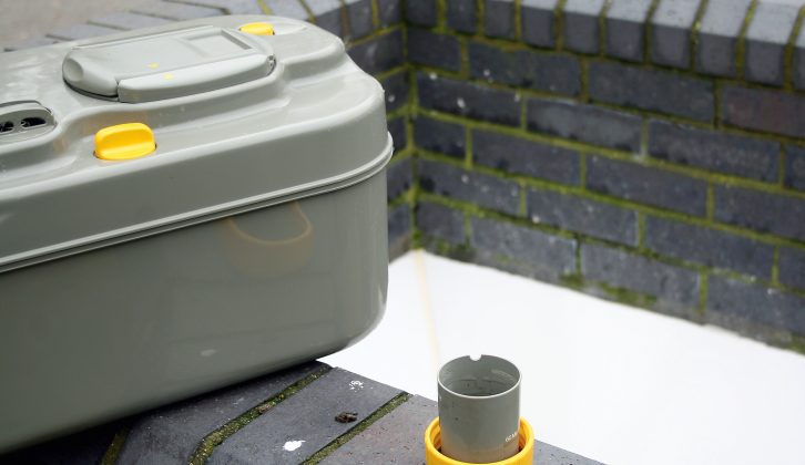 Careful not to lose the cap from the emptying spout in your caravan loo cassette – never place it on the edge of the chemical toilet emptying point like this, or it's bound to go flying in!