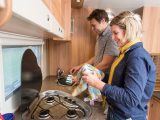 There is little space between the three-burner gas hob and the stainless-steel sink — only enough for a compact, clip-on drainer that may be a bit small for a family