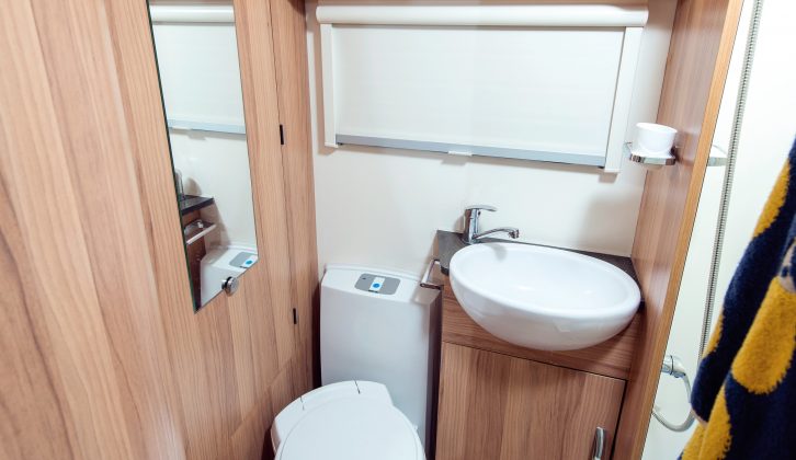 The freestanding dining table is stored in the wardrobe, but this is in the washroom, so expect to hike the length of the van before meals