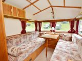 Wooden ceiling battens and soft furnishings recovered from an old Swift complete the decor inside this vintage caravan