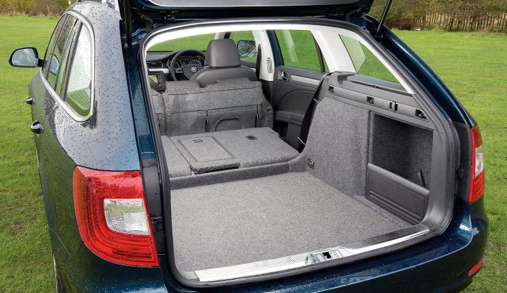 Fold the seats flat to reveal the Škoda Superb Estate's full 1865-litre boot