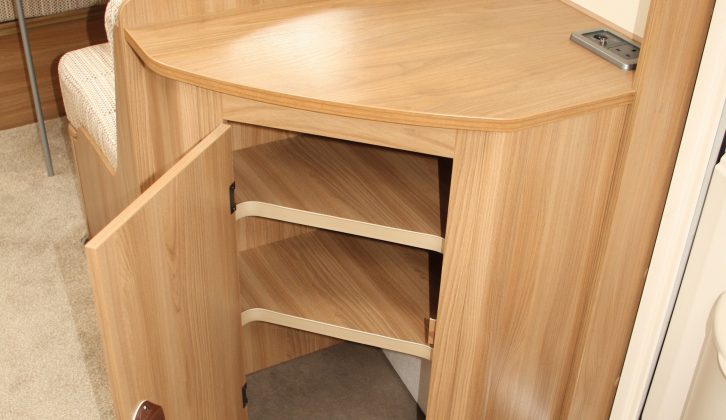 The dresser adds storage and workspace between the kitchen and the lounge/bedroom