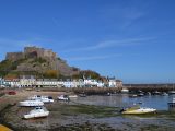 Mont Orgueil Castle towers over the pretty Gorey Harbour where you'll find cafes and restaurants aplenty