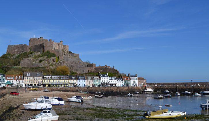 Mont Orgueil Castle towers over the pretty Gorey Harbour where you'll find cafes and restaurants aplenty