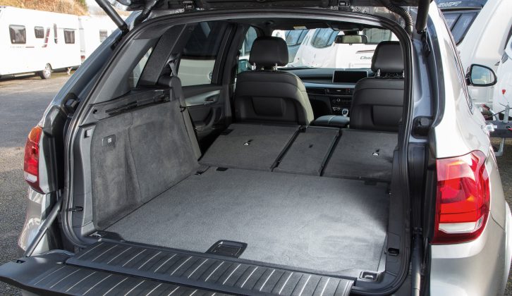 Fold the BMW X5's seats down and the boot floor isn't quite flat, but it is 185cm long, giving a 1870-litre capacity