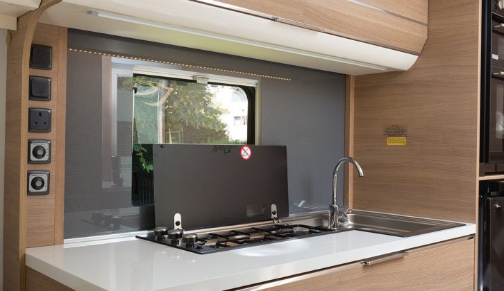 In the kitchen of the Rhine caravan you'll find a lateral three-burner hob to allow more worktop in front and to the side, where the sockets are located