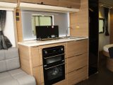 The new slimline fridge gives extra worktop space in this 2016 Adria Adora 613 DT Isonzo Jubilee edition