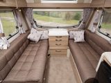 The lounge  seats are long enough to be used as twin beds. Otherwise, it can be converted into a double by pulling slats from the central chest of drawers between the seats, and arranging the cushions. The resulting bed is generously sized in the 2015  Sprite Major 4 SB caravan