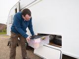 The enormous storage space beneath the island bed in the 2015 Sprite caravan can be accessed via an outdoor hatch, but it should not be filled until you’re on site