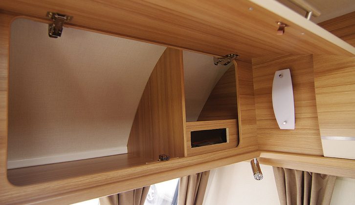 The overhead lockers provide a mix of open and shelved storage areas in the Quasar 646 for 2015