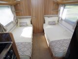 In the rear of the Lunar Delta TS the inviting 1.87m fixed twin beds are the same length as each other