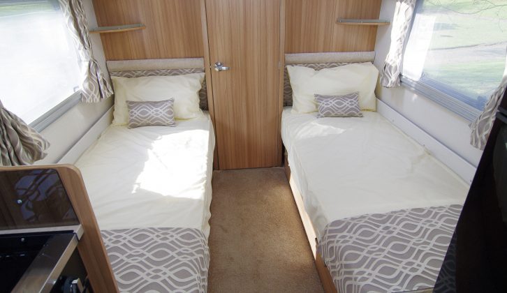 In the rear of the Lunar Delta TS the inviting 1.87m fixed twin beds are the same length as each other