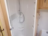 The standalone cylindrical shower cubicle is back, but has a trendy over-size shower head and lots of shelves